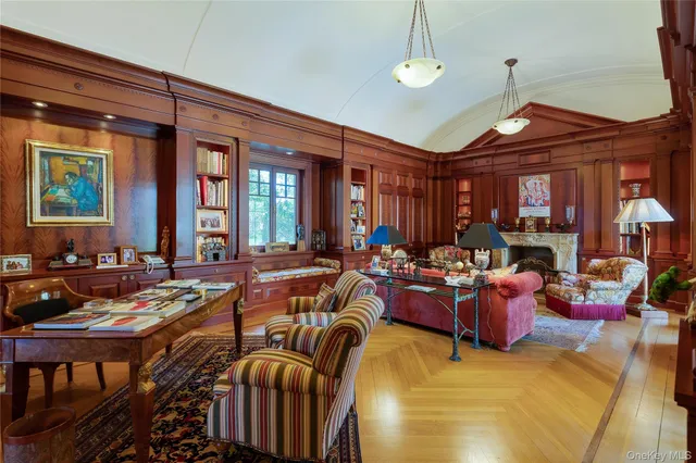 a view of staircase with a lots of frames on wall