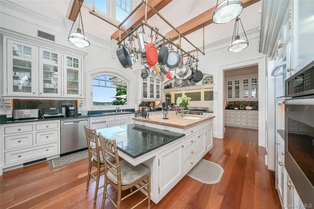 a dining room with furniture and wooden floor