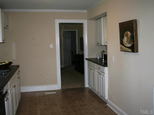 735 Colonial Drive Raleigh, NC 27603 - Photo 5 of 6 Another view of kitchen, new cabinets, counters, flooring! Kitchen