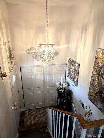 a bed sitting in a bedroom next to a bathroom