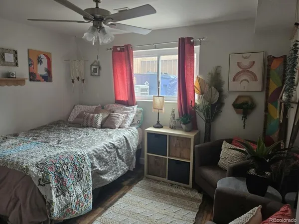 a bathroom with a granite countertop sink a toilet and bathtub