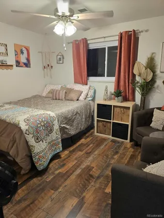 a kitchen with granite countertop a refrigerator stove top oven and sink