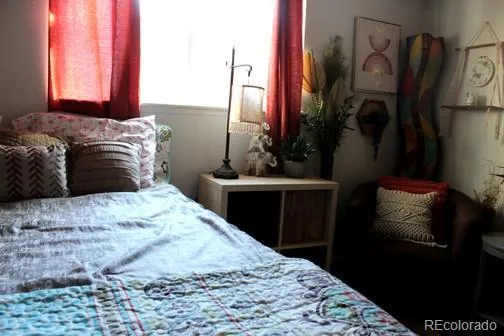 a bedroom with a bed and a mirror