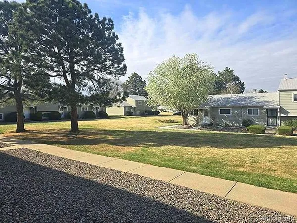 a view of a balcony with furniture