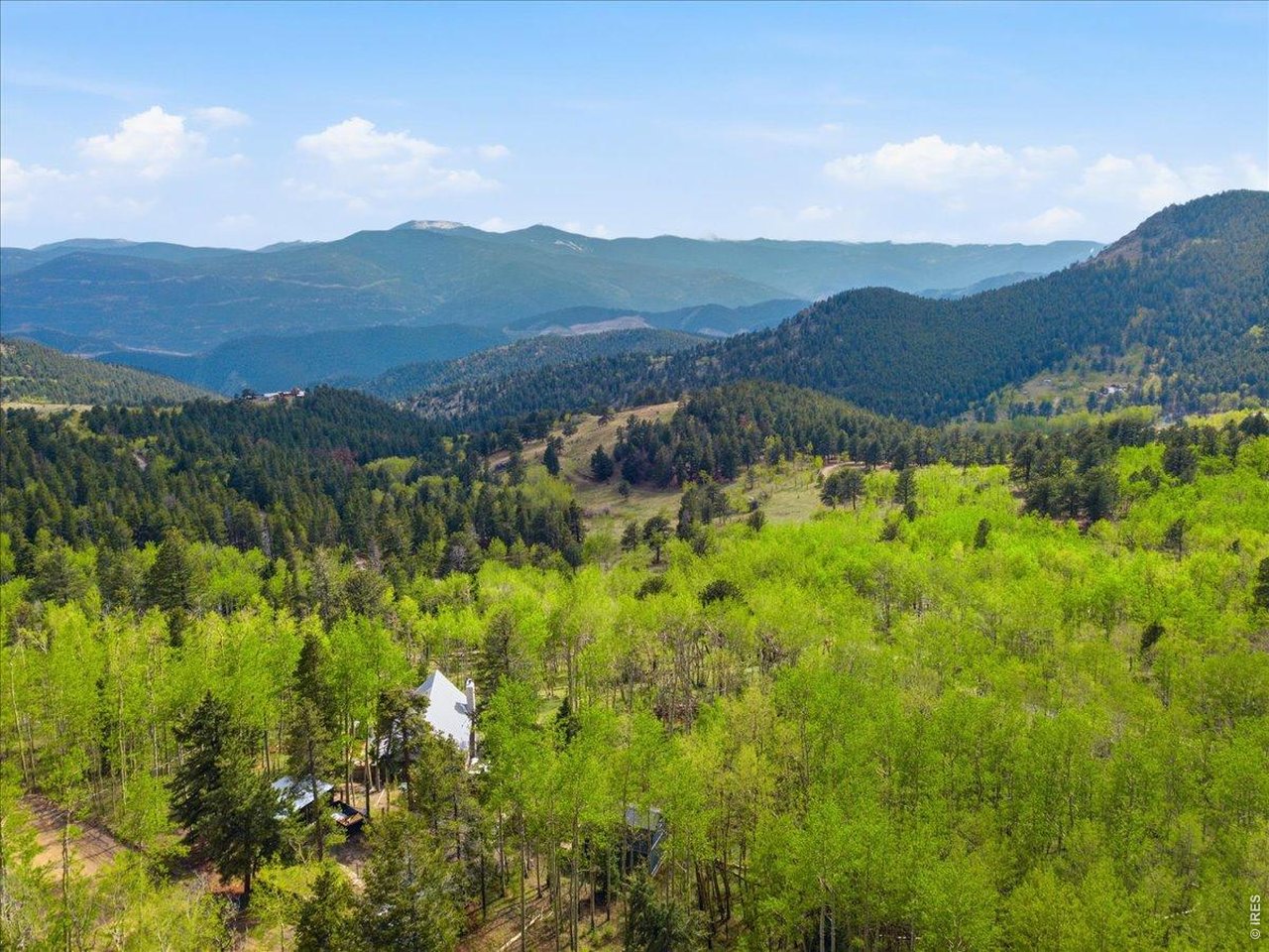 1800 Robinson Hill Road Black Hawk, CO 80422 - Photo 5 of 30 a view of a lush green hillside and houses