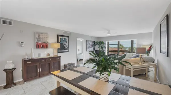 a kitchen with granite countertop a refrigerator stove and sink