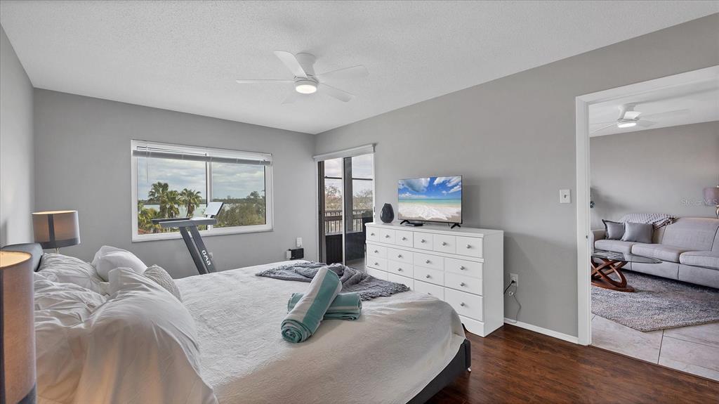 8625 Midnight Pass Road, Unit 506B Sarasota, FL 34242 - Photo 21 of 37 a bed room with furniture and a window