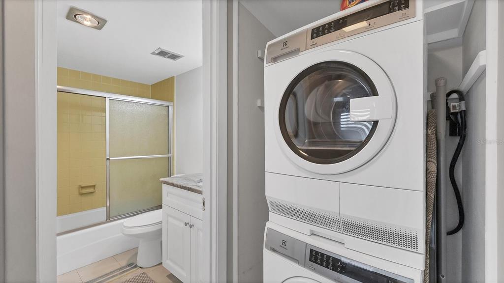8625 Midnight Pass Road, Unit 506B Sarasota, FL 34242 - Photo 26 of 37 a bathroom with a toilet a sink and a shower