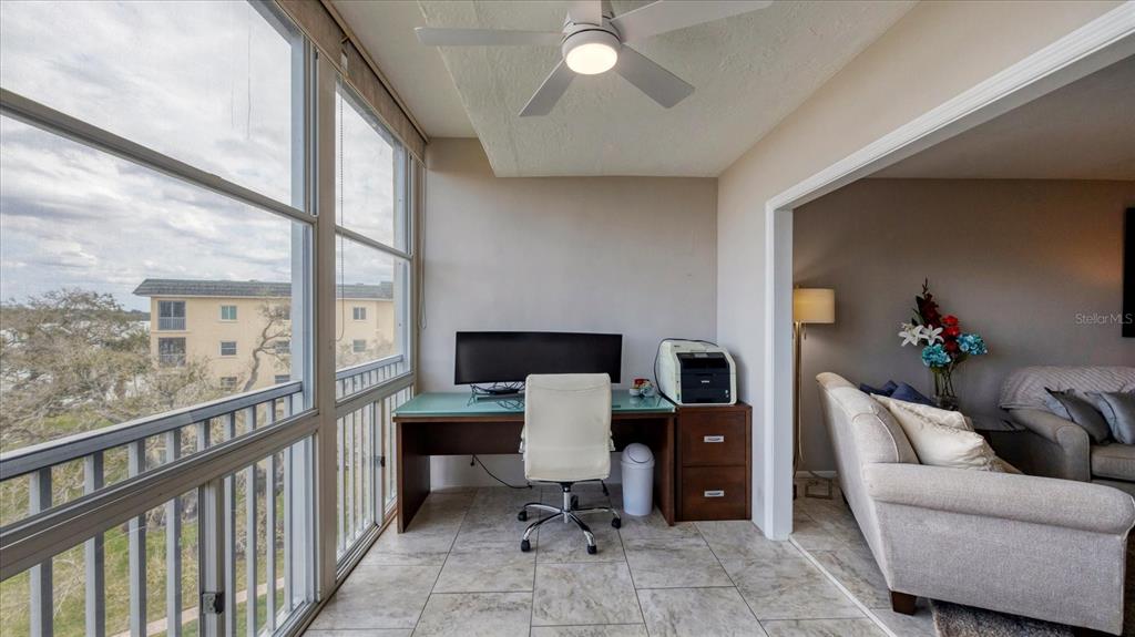 8625 Midnight Pass Road, Unit 506B Sarasota, FL 34242 - Photo 30 of 37 a workspace with furniture and window