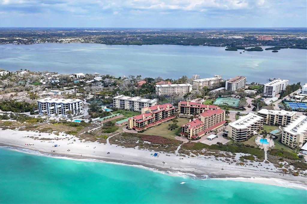 8625 Midnight Pass Road, Unit 506B Sarasota, FL 34242 - Photo 37 of 37 a view of a lake with a city
