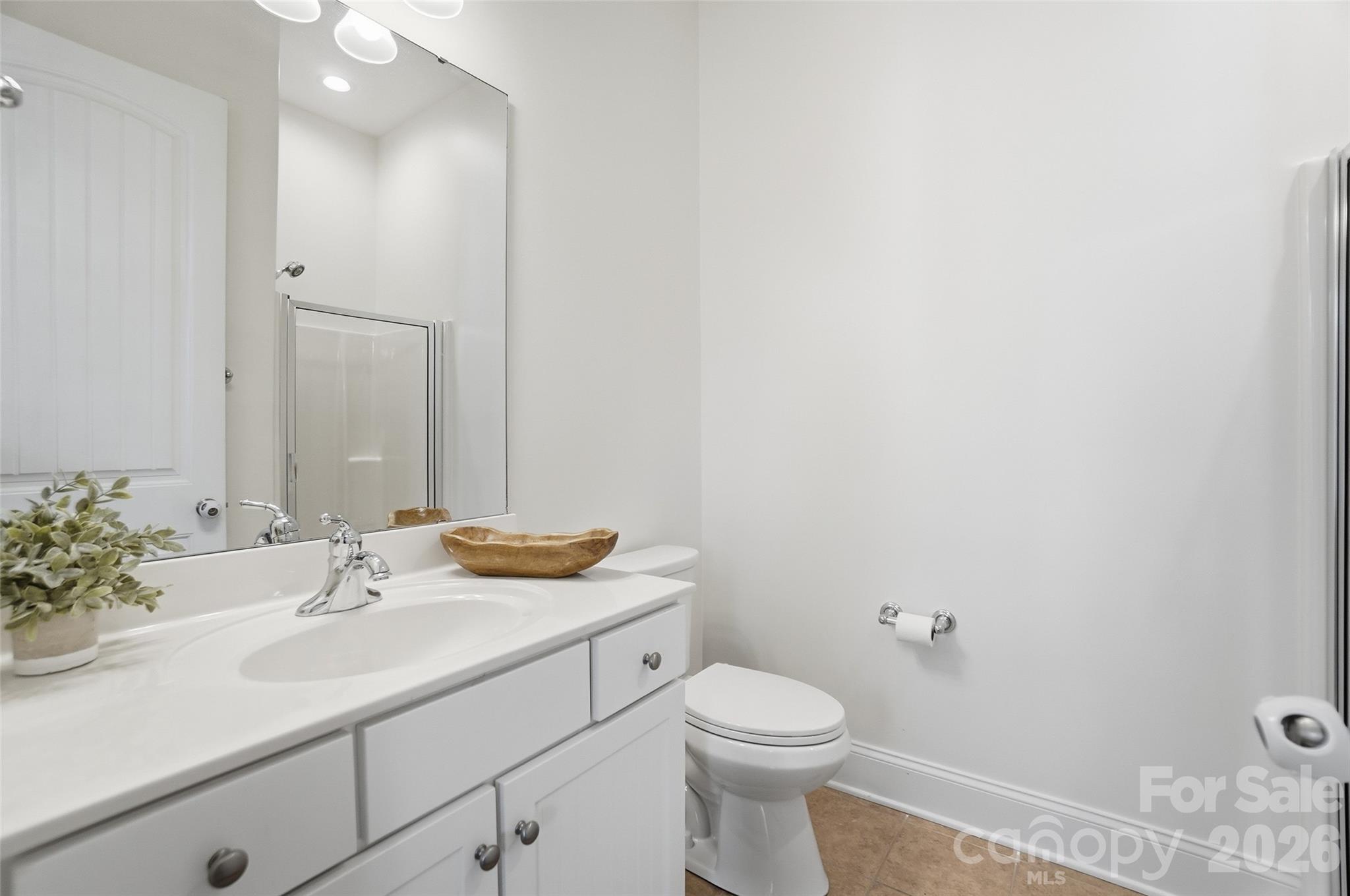 3383 Keady Mill Loop Kannapolis, NC 28081 - Photo 18 of 47 a bathroom with a sink and a mirror