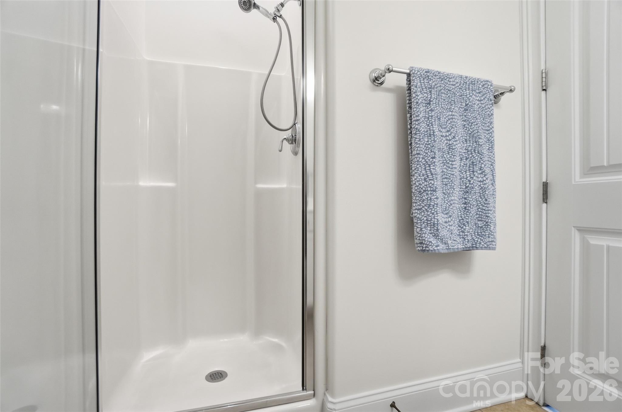 3383 Keady Mill Loop Kannapolis, NC 28081 - Photo 19 of 47 a bathroom with a glass shower door