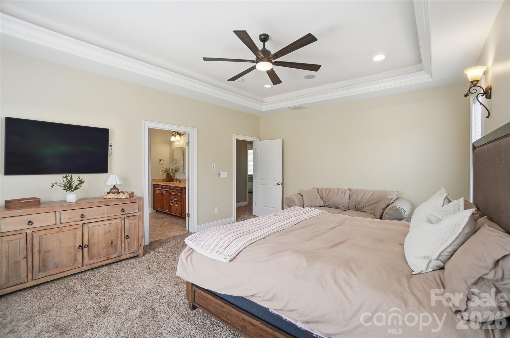 3383 Keady Mill Loop Kannapolis, NC 28081 - Photo 24 of 47 a bedroom with a bed and a flat screen tv