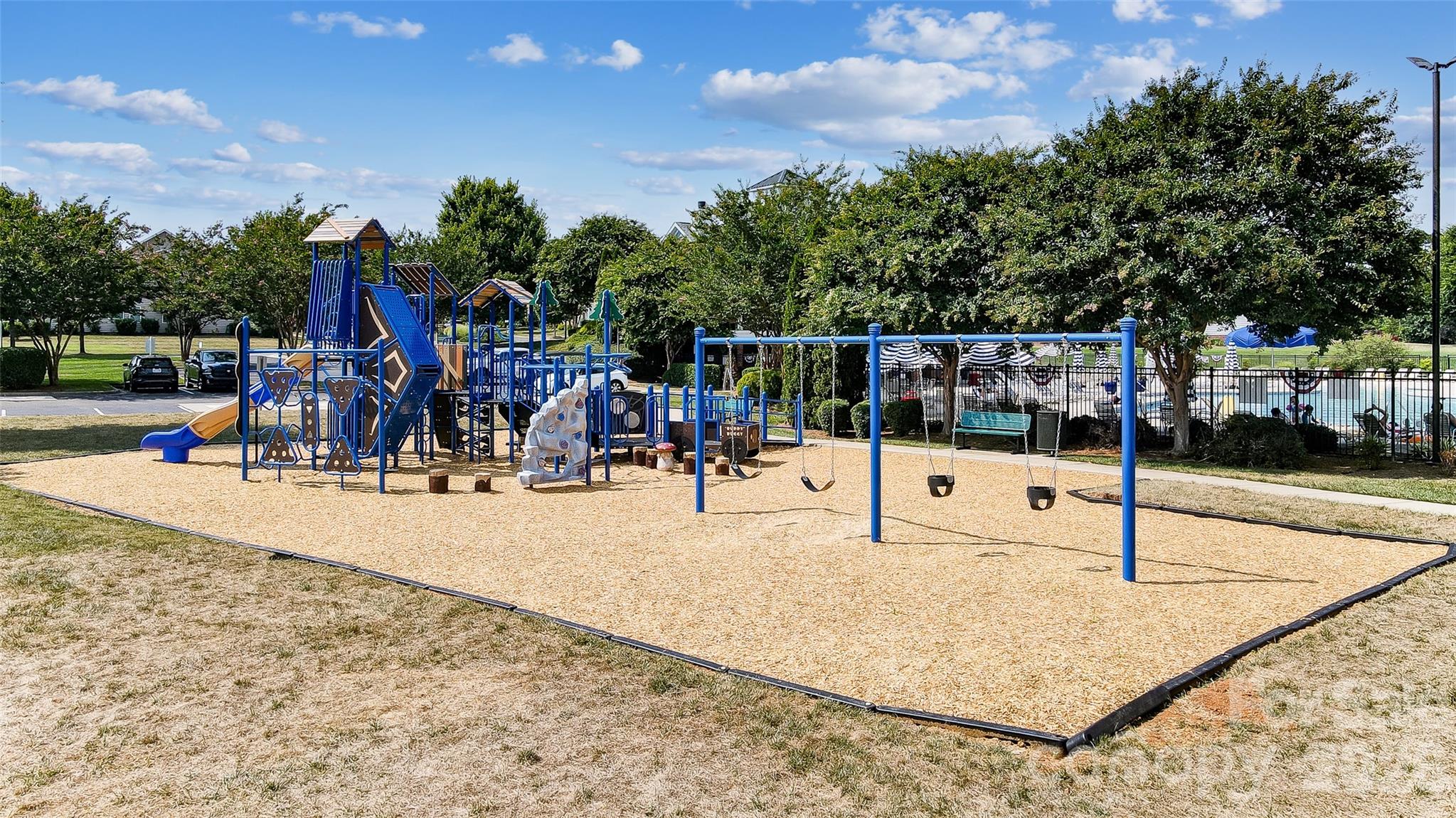 3383 Keady Mill Loop Kannapolis, NC 28081 - Photo 44 of 47 a view of a park with swings and slides