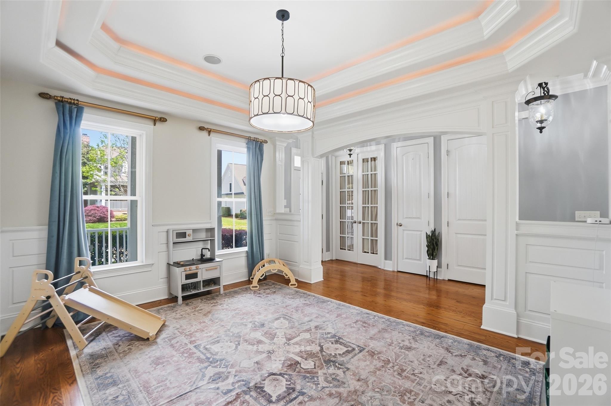 3383 Keady Mill Loop Kannapolis, NC 28081 - Photo 8 of 47 a living room with hardwood floor furniture and a chandelier