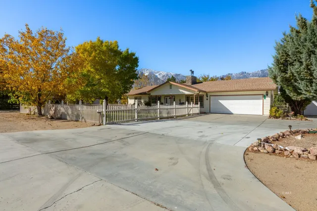 front view of a house with a trees