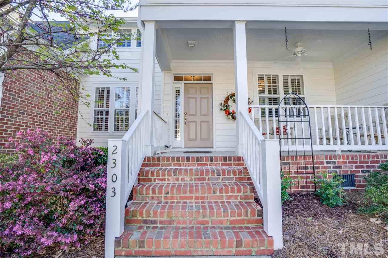 2303 Dunlin Lane Raleigh, NC 27614 - Photo 2 of 25 front view of a brick house with a small yard