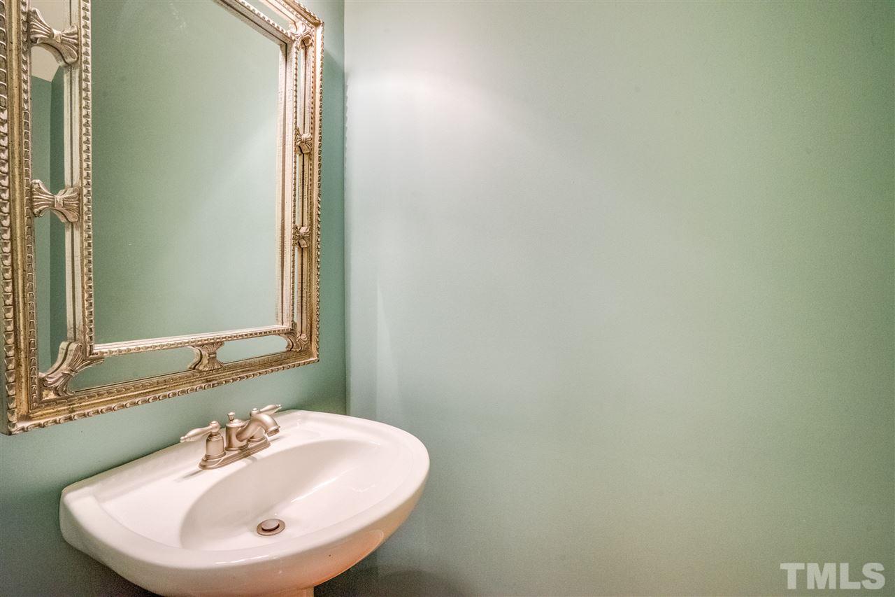 2303 Dunlin Lane Raleigh, NC 27614 - Photo 11 of 25 a bathroom with a sink and a mirror