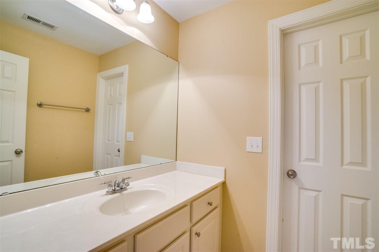 2303 Dunlin Lane Raleigh, NC 27614 - Photo 17 of 25 a bathroom with a sink vanity and a mirror