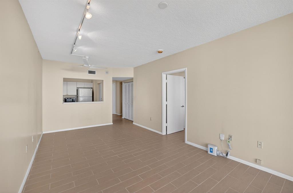 3020 Northeast 32nd Avenue, Unit 819 Fort Lauderdale, FL 33308 - Photo 18 of 68 an empty room with windows and closet