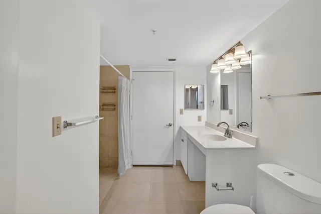 a bathroom with a shower and a shower curtain