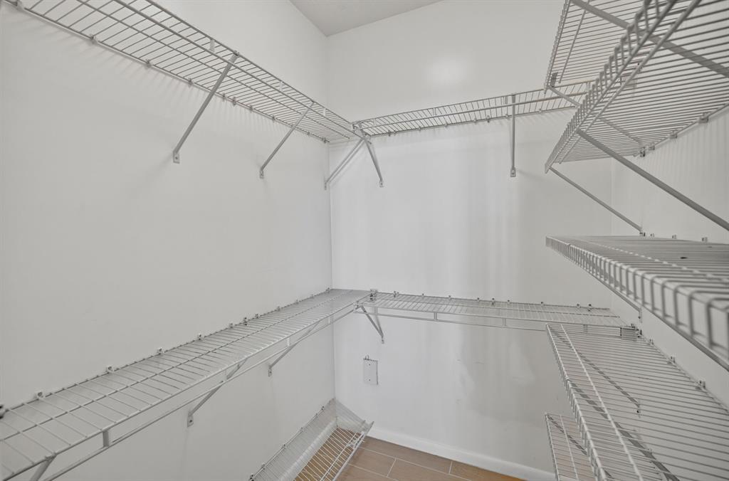 3020 Northeast 32nd Avenue, Unit 819 Fort Lauderdale, FL 33308 - Photo 26 of 68 a view of a room with racks on the wall