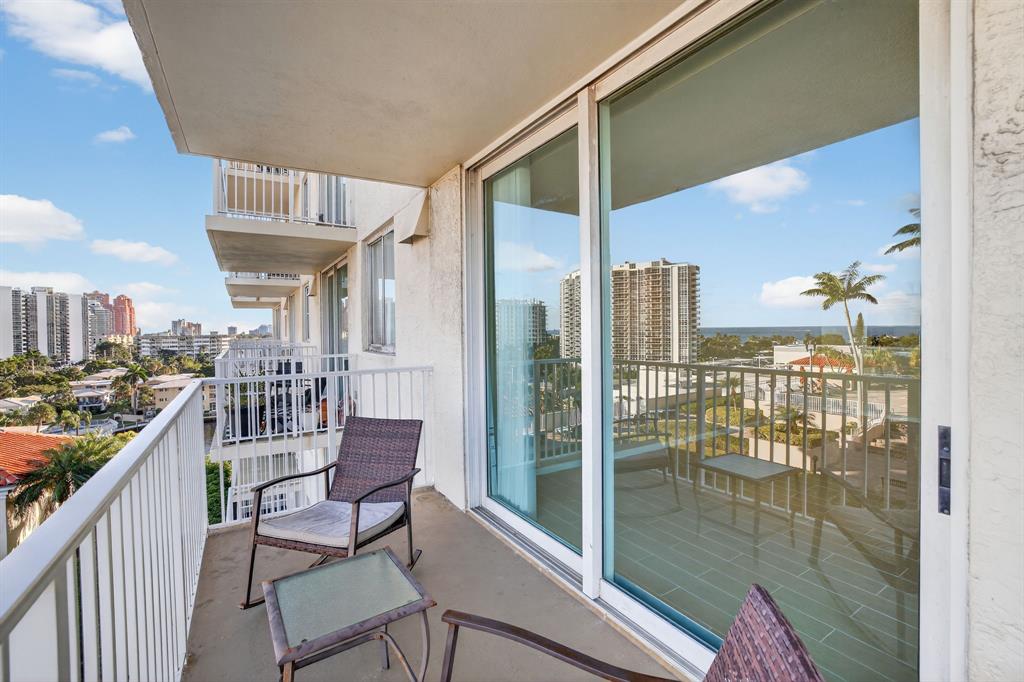 3020 Northeast 32nd Avenue, Unit 819 Fort Lauderdale, FL 33308 - Photo 6 of 68 a view of a balcony with furniture