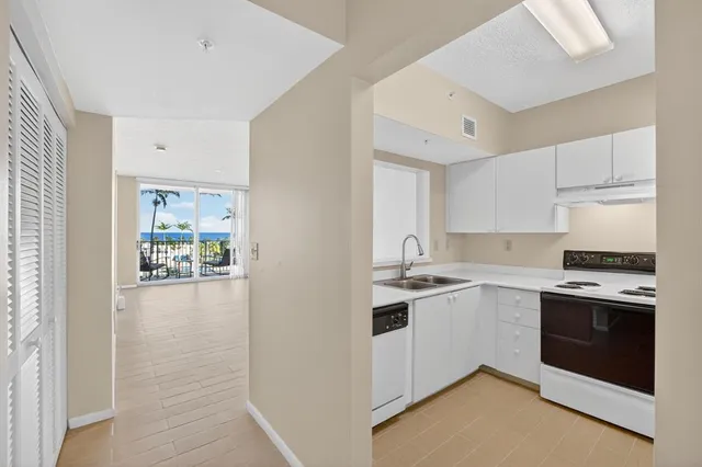 a kitchen with a refrigerator sink and microwave