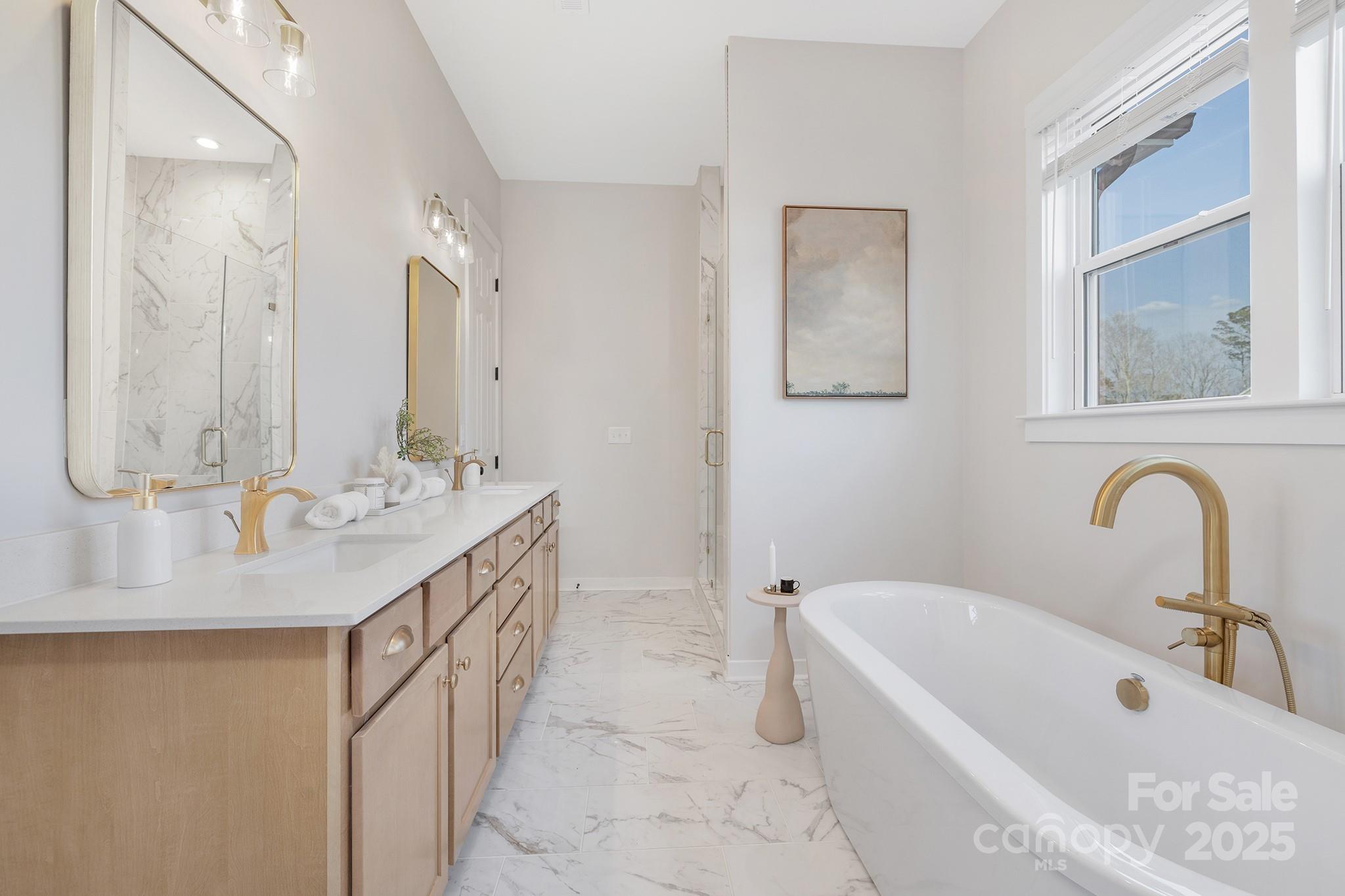 13097 Arnold Palmer Circle, Unit 844 Lancaster, SC 29720 - Photo 18 of 38 a bathroom with a double vanity sink mirror and bathtub