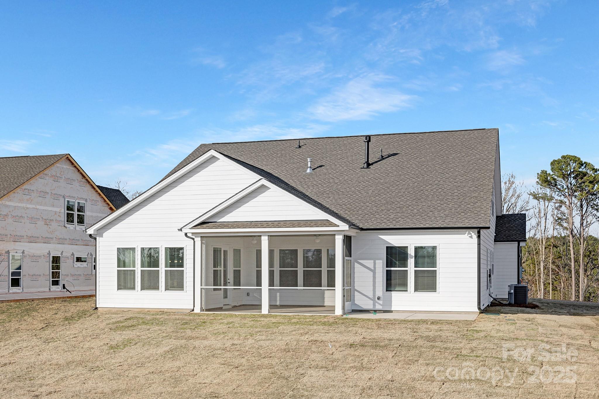 13097 Arnold Palmer Circle, Unit 844 Lancaster, SC 29720 - Photo 38 of 38 a front view of a house with a garden