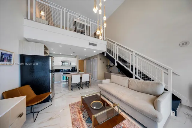 a living room with furniture and a piano