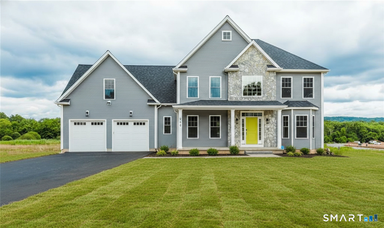 a front view of house with yard and green space