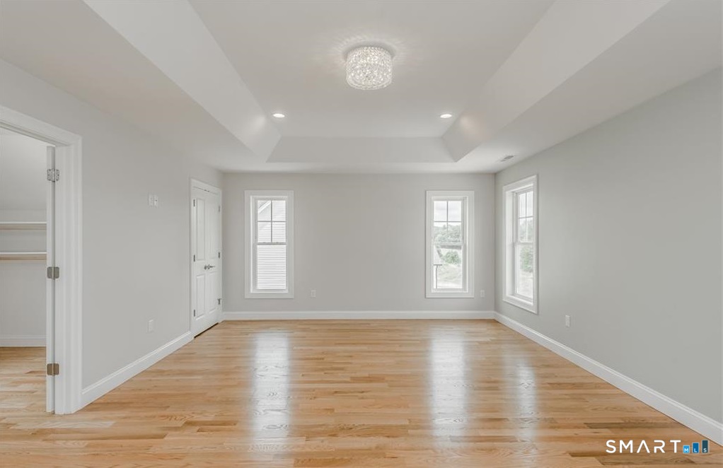 106 Rock Ridge Road Manchester, CT 06040 - Photo 11 of 19 a view of empty room with wooden floor and fan