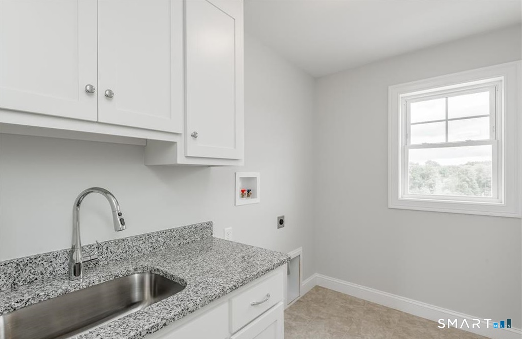 106 Rock Ridge Road Manchester, CT 06040 - Photo 19 of 19 a view with a sink and cabinets