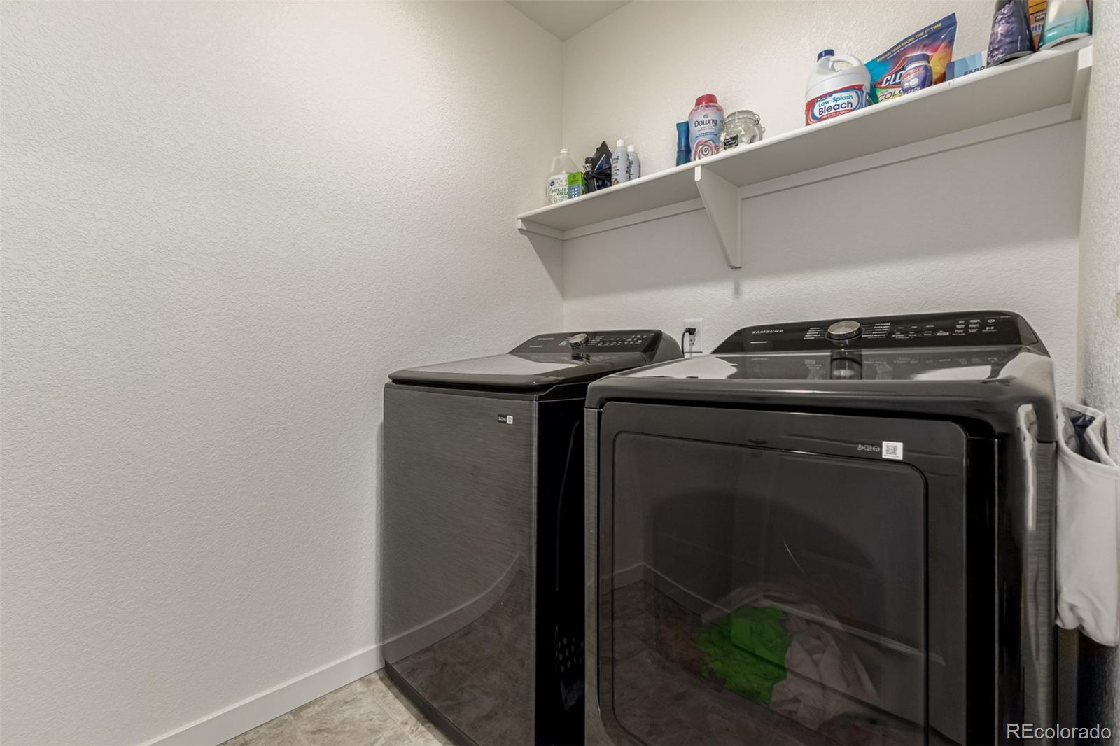 773 Allium Street Watkins, CO 80137 - Photo 29 of 46 a utility room with dryer and washer