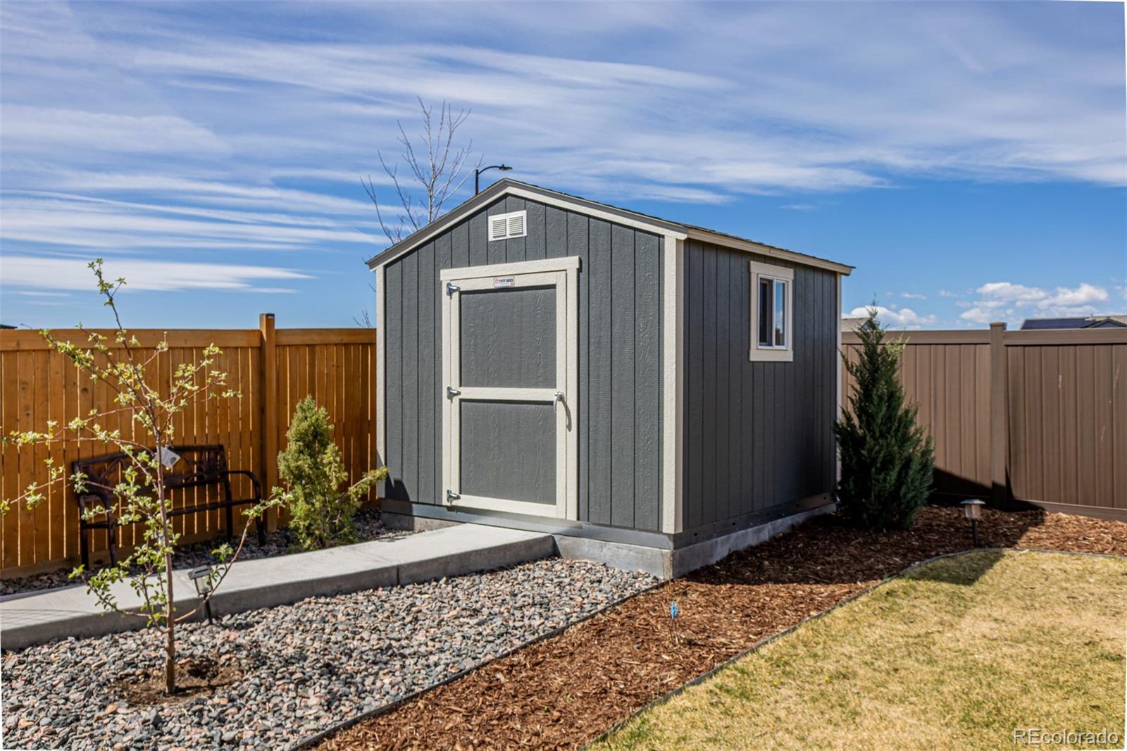 773 Allium Street Watkins, CO 80137 - Photo 31 of 46 a view of a house with backyard