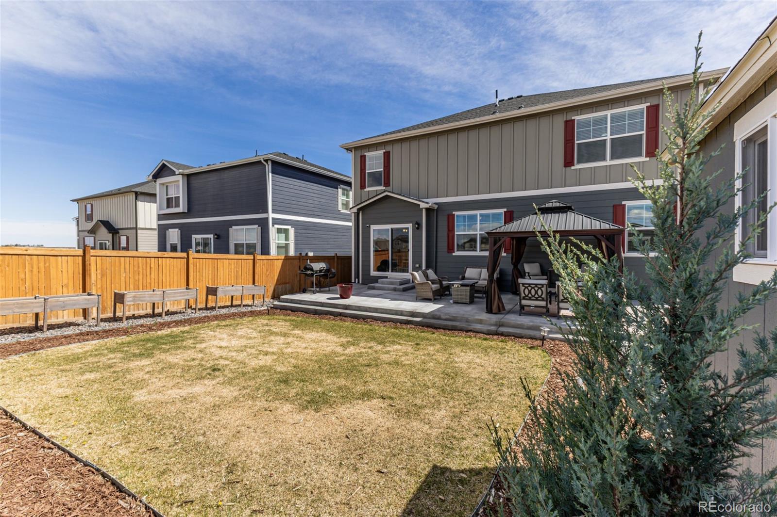 773 Allium Street Watkins, CO 80137 - Photo 34 of 46 a view of a house with pool and sitting area