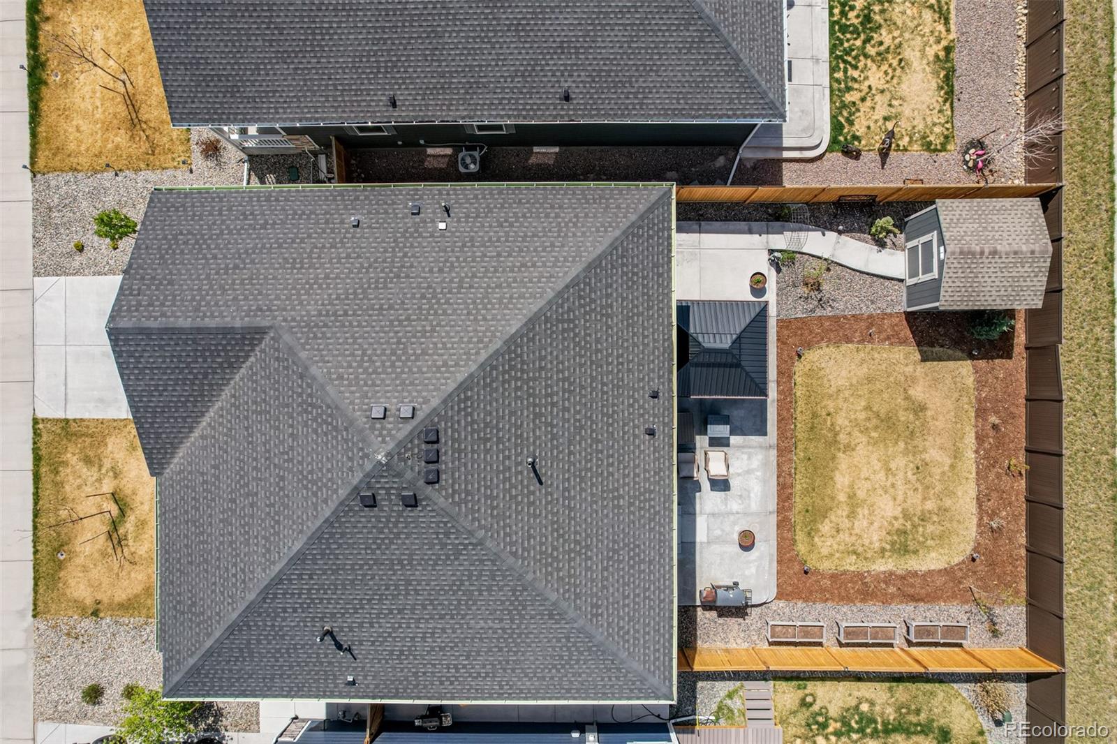 773 Allium Street Watkins, CO 80137 - Photo 36 of 46 an aerial view of a house with a yard