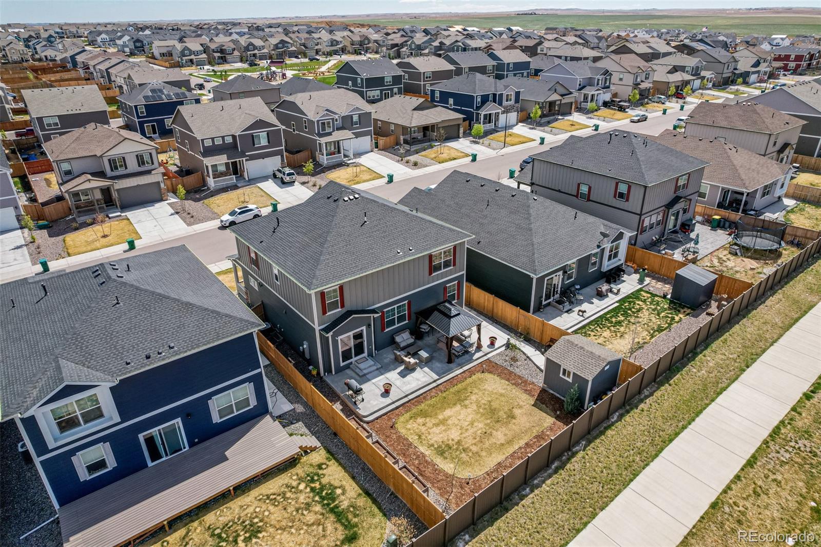 773 Allium Street Watkins, CO 80137 - Photo 40 of 46 an aerial view of residential houses with yard