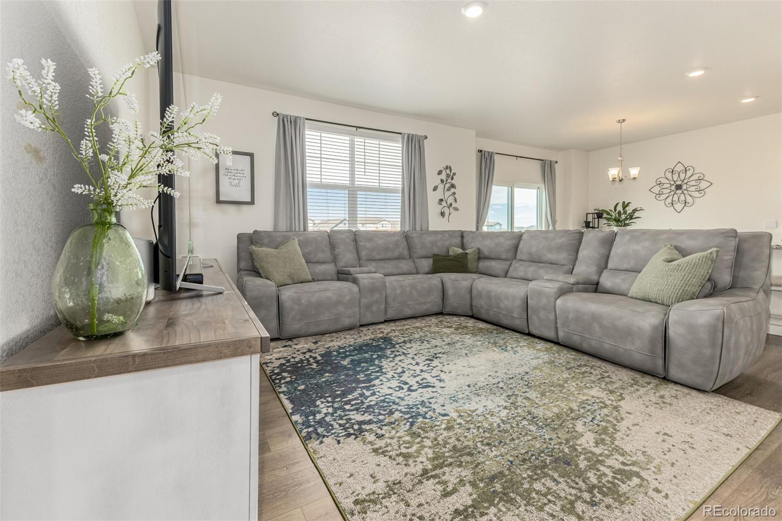 773 Allium Street Watkins, CO 80137 - Photo 9 of 46 a living room with furniture and a couch