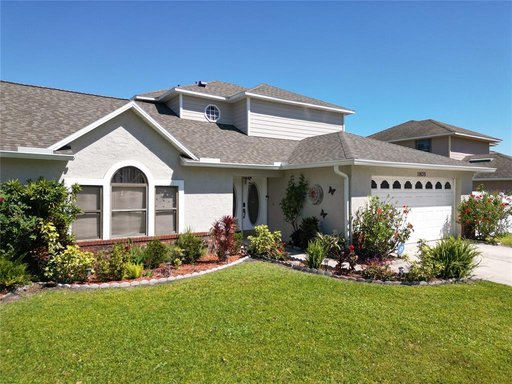 11635 Darlington Drive Orlando, FL 32837 - Photo 1 of 1 a front view of a house with a yard