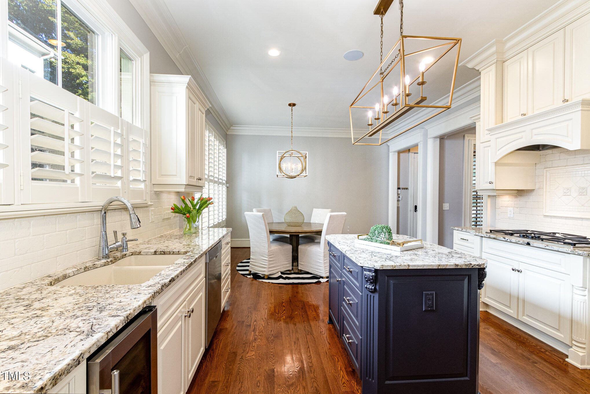 7814 Monument Lane Raleigh, NC 27615 - Photo 10 of 52 Sunny kitchen with granite countertops, undercounter lighting