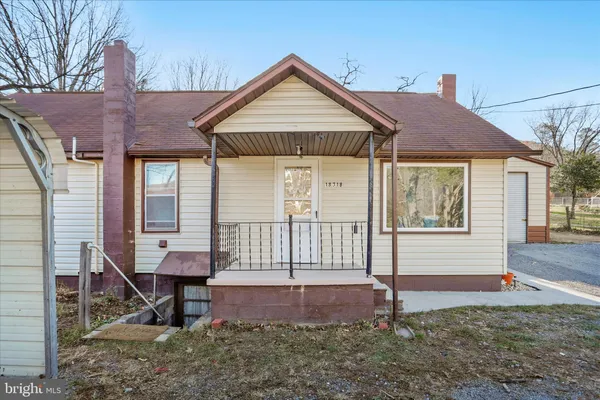 a front view of a house with a porch