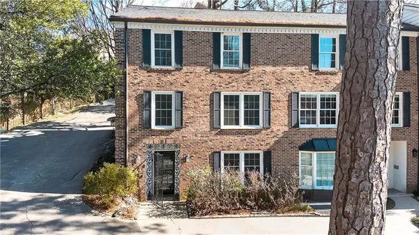 a front view of a house with yard