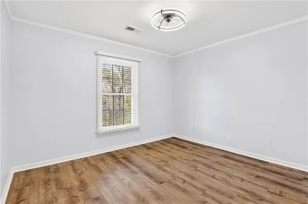 a bedroom with a bed and a ceiling fan