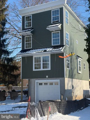 a view of a house with a street