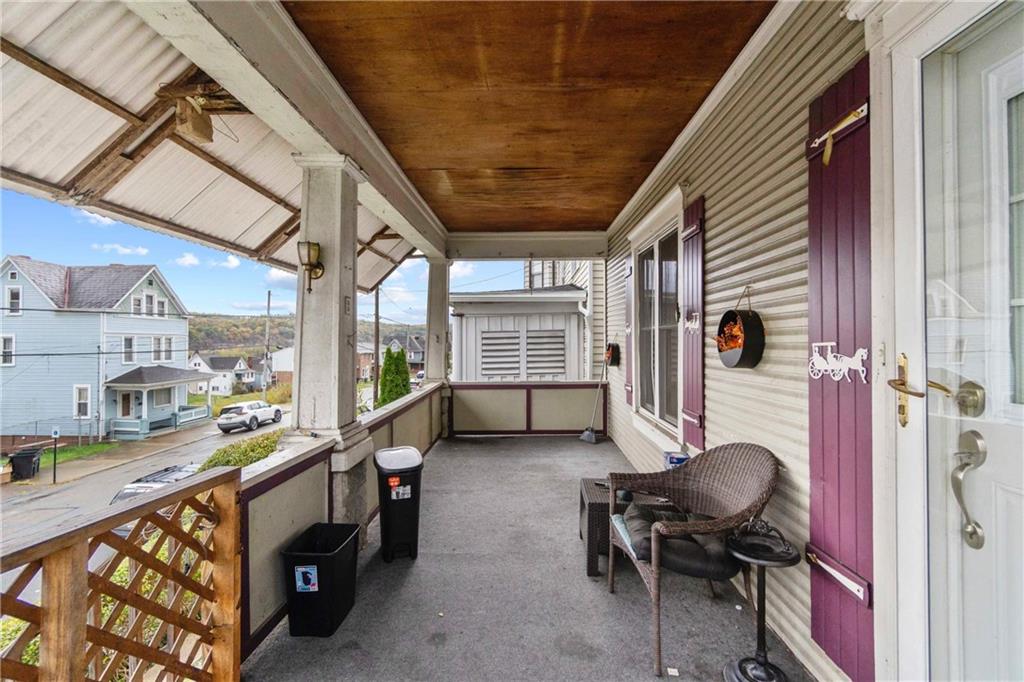 999 Thompson Avenue Donora, PA 15033 - Photo 2 of 24 a view of a porch with furniture and a window