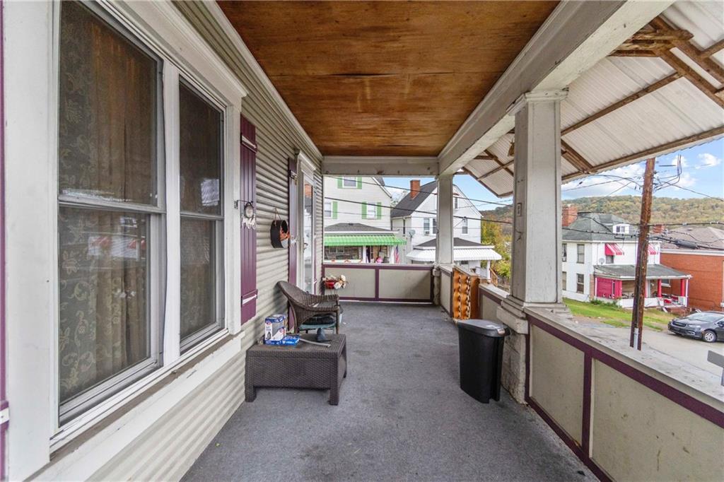 999 Thompson Avenue Donora, PA 15033 - Photo 3 of 24 a building outdoor space with patio furniture and a potted plant