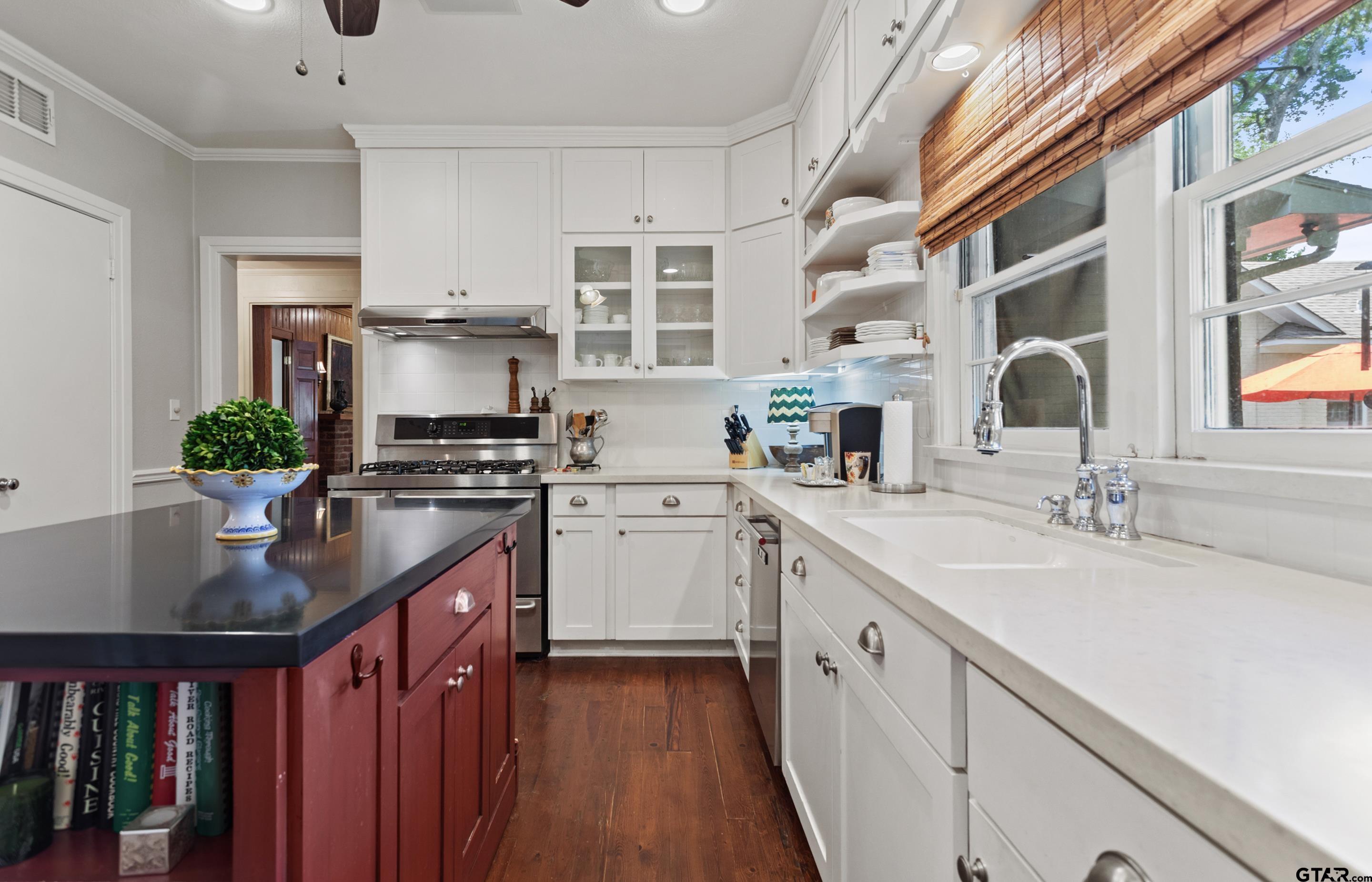 2631 Old Bullard Road Tyler, TX 75701 - Photo 24 of 43 a kitchen with granite countertop a sink stove and cabinets