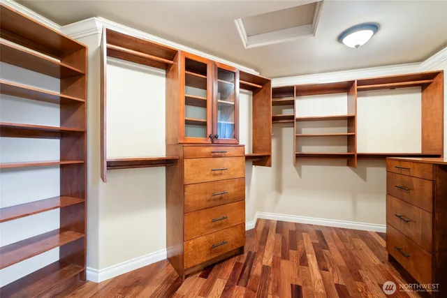 a spacious bathroom with a sink and a mirror